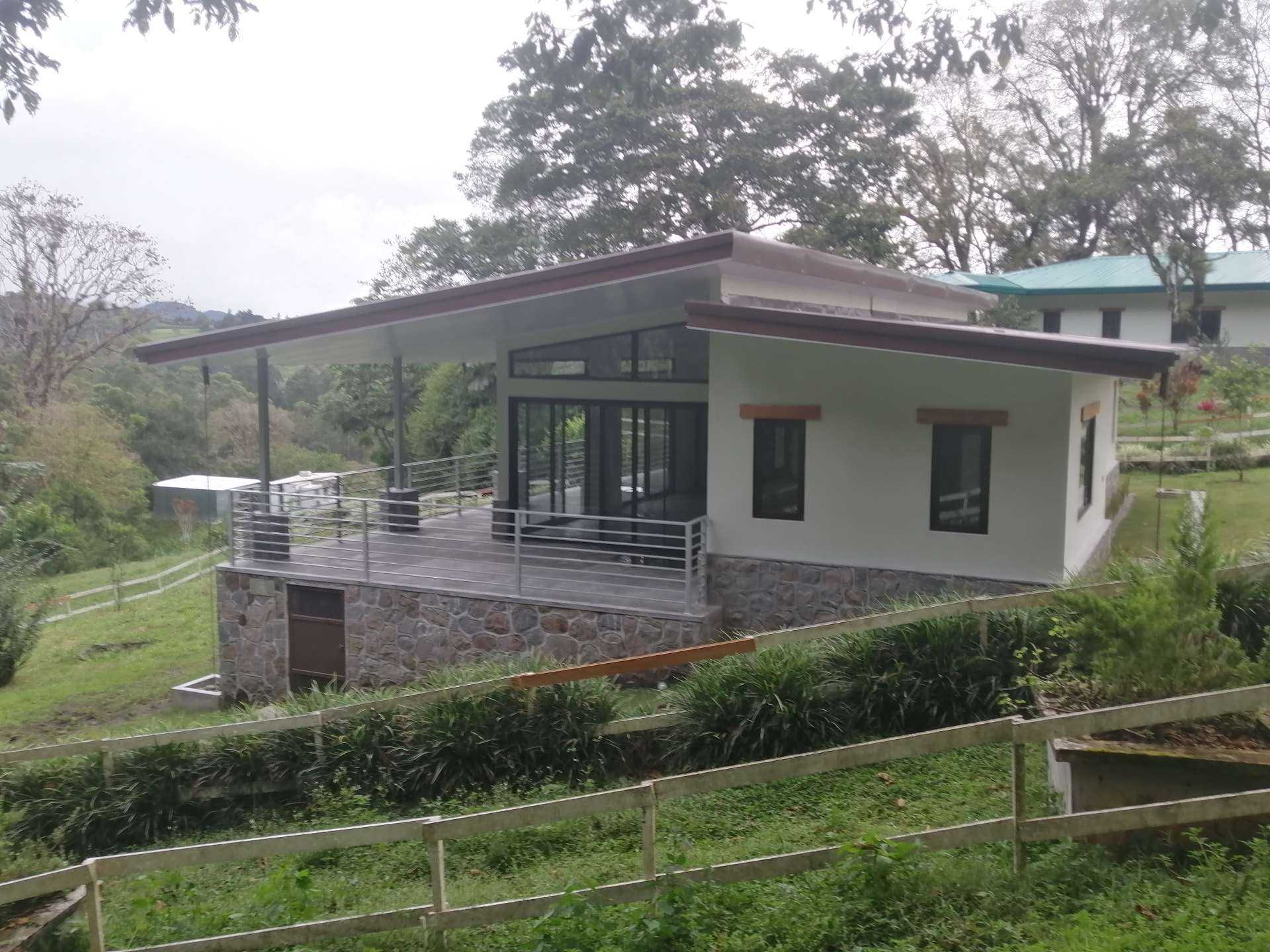 Concrete Residence Integrated With the Surrounding Landscape